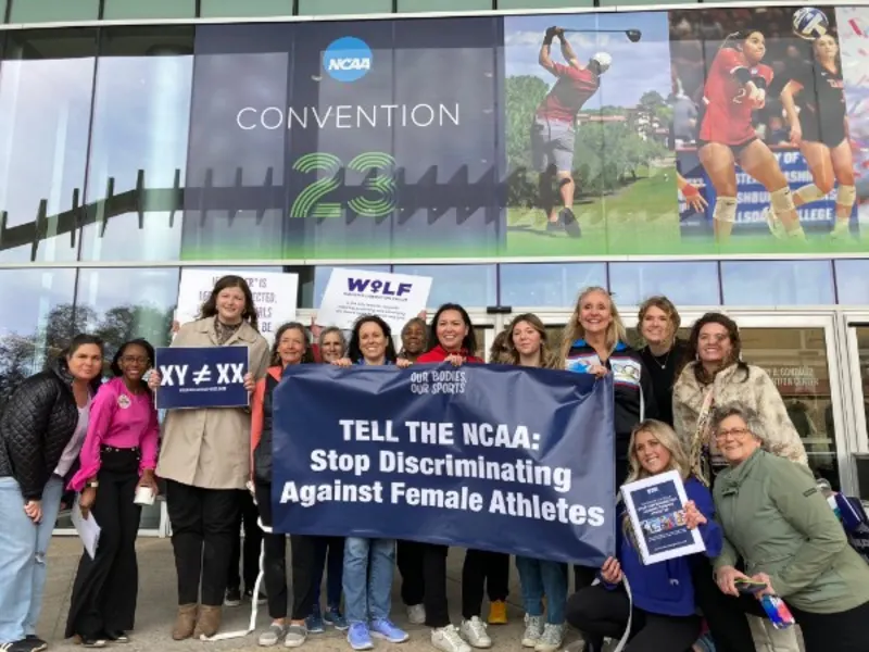 ICONS and supporters outside the 2023 NCAA Convention with a Tell the NCAA banner