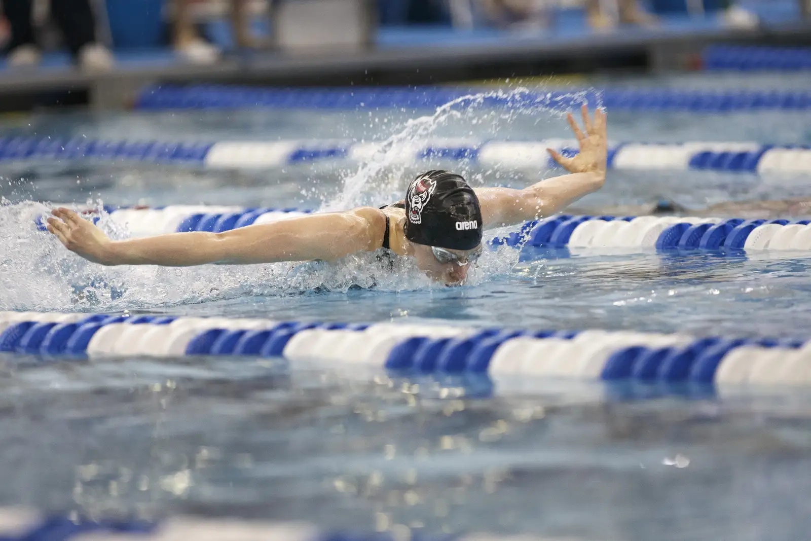 NC State swimmer Kylee Alons swims butterfly in a race